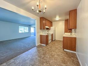 San Carlos apartment for rent - A kitchen with a refrigerator, stove, and sink.