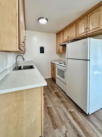 Los Gatos apartment for rent - a kitchen with white appliances and wooden cabinets