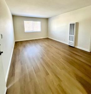 San Jose apartment for rent - A room with wooden flooring and a window.