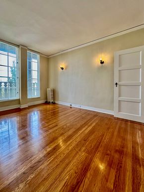 San Mateo apartment for rent - an empty living room with wood floors and a white door
