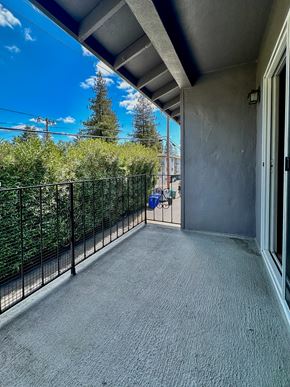 Mountain View apartment for rent - the balcony of a condo with a view of the yard and trees
