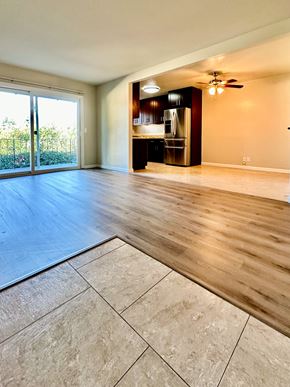Mountain View apartment for rent - an empty living room with a kitchen and a sliding glass door
