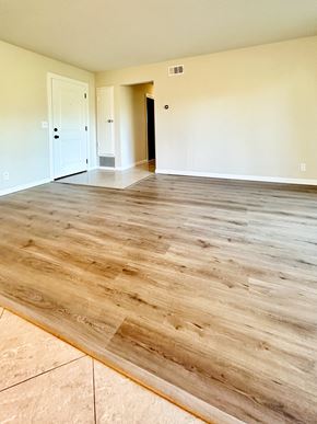 Mountain View apartment for rent - the living room and dining room of a new home with wood flooring