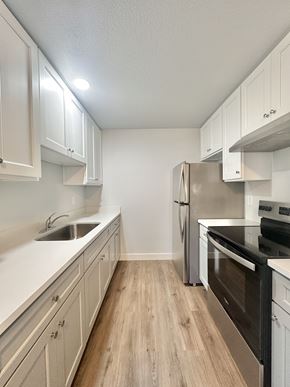 South San Francisco apartment for rent - A kitchen with a stainless steel refrigerator, oven, and microwave.