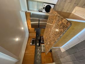 Cupertino apartment for rent - A kitchen with granite countertops and stainless steel appliances.