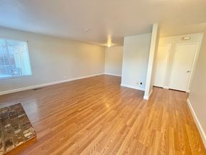 Castro Valley apartment for rent - A room with wooden flooring and white walls.