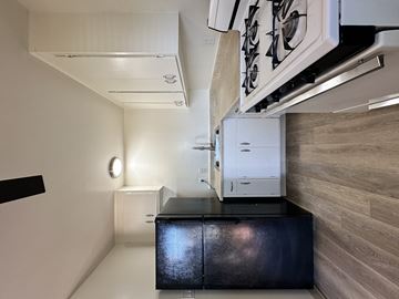 Newark apartment for rent - A kitchen with a stove and a refrigerator.
