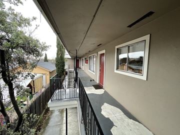 Redwood City apartment for rent - a view of a building with a balcony and a window