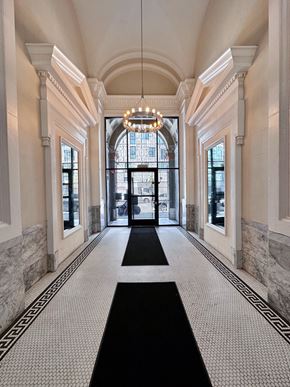San Francisco apartment for rent - a large hallway with a chandelier and large windows