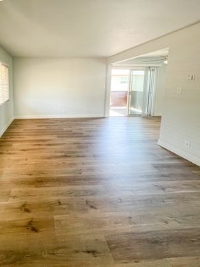 Redwood City apartment for rent - an empty living room with wood flooring in a house