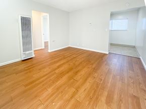 Santa Clara apartment for rent - an empty living room with wood flooring and white walls