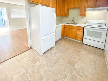 Santa Clara apartment for rent - A kitchen with a white refrigerator, stove, and oven.