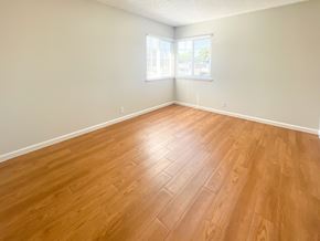 Santa Clara apartment for rent - an empty living room with wood floors and a window
