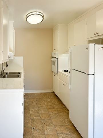 Santa Clara apartment for rent - a kitchen with white appliances and white cabinets