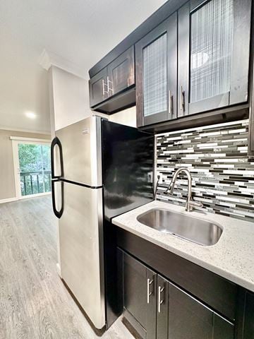 Burlingame apartment for rent - A white refrigerator is in a kitchen with a black counter.