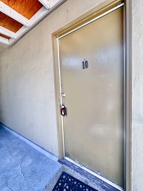 San Jose apartment for rent - a metal door with the number 10 on it