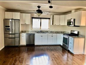 Redwood City apartment for rent - a kitchen with a stainless steel refrigerator freezer and a stove top oven