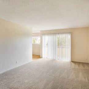 Hayward apartment for rent - an empty living room with a sliding glass door