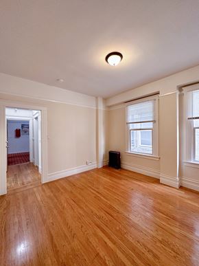 San Francisco apartment for rent - a living room with hardwood floors and two windows