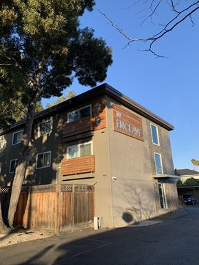 San Mateo apartment for rent - an old building with a tree in front of it