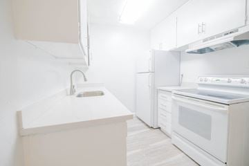 Alameda apartment for rent - a white kitchen with white appliances and a white counter top