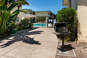 Hayward apartment for rent - a backyard with a bench and a swimming pool