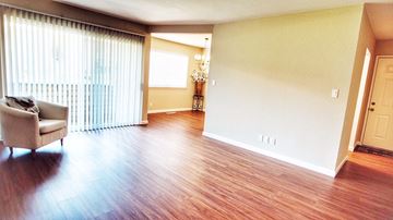 Mountain View apartment for rent - A living room with a couch and a chandelier.
