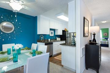 Cupertino apartment for rent - A modern kitchen with a dining table set for two.