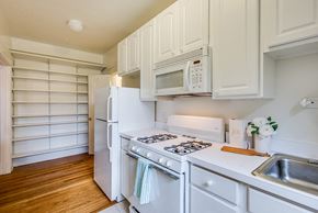Washington apartment for rent - Apartment kitchen with classic finishes and pantry space at 4115 Wisconsin, Washington, DC, 20016