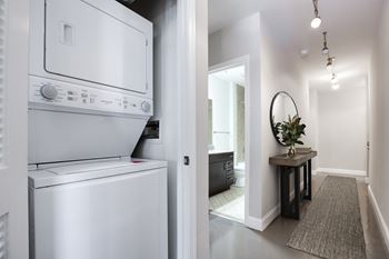A white oven and dishwasher in a modern kitchen.