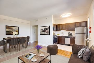 Washington apartment for rent - A living room with a brown couch and a coffee table.