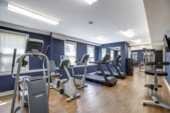 A gym with cardio equipment and treadmills at park crest apartments, district of columbia 20007