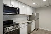 Arlington apartment for rent - Renovated kitchen with granite countertops and stainless steel appliances  at Lenox Club, National Landing, Arlington, VA 22202