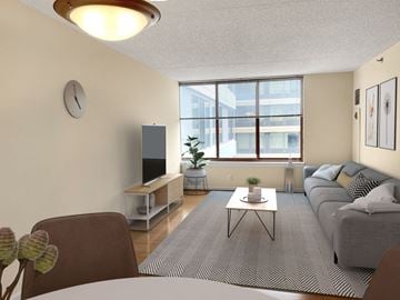 Arlington apartment for rent - a living room with a couch and a table and a window