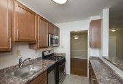 Alexandria apartment for rent - Partially renovated kitchen with stainless steel appliances at Mason Hall in Alexandria, VA 22314