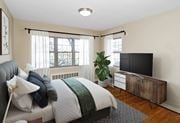 Alexandria apartment for rent - A bedroom with a bed and a tv at Mason Hall in Alexandria, VA 22314