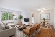 Alexandria apartment for rent - Living room, dining area and kitchen (virtually staged) at Mason Hall in Alexandria, VA 22314