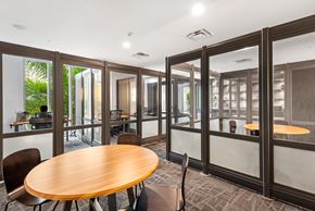 Miami apartment for rent - A conference room with a table and chairs.