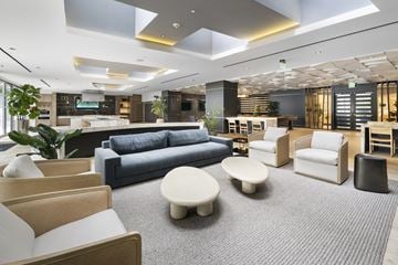 Miami apartment for rent - A modern living room with a grey carpet and furniture.