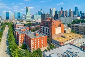 Jersey City apartment for rent - A cityscape with a mix of modern and older buildings.