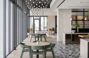 Miami apartment for rent - A modern dining area with green chairs and a patterned floor.