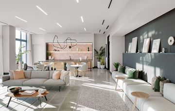 Miami apartment for rent - A modern living room with a grey sofa, a coffee table, and a dining table set up.