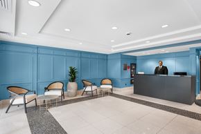 Jersey City apartment for rent - A reception area with a person standing behind the desk.