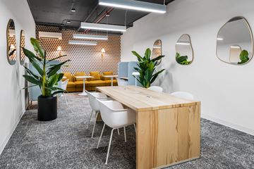 Jersey City apartment for rent - A conference room with a long table and chairs.