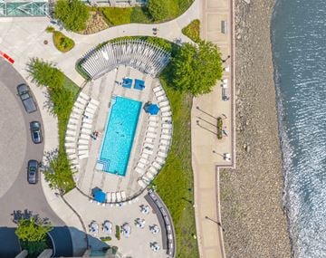 Jersey City apartment for rent - An aerial view of a pool surrounded by a stone wall.