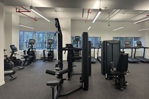 Jersey City apartment for rent - A gym with a variety of equipment including treadmills, weights, and exercise machines.