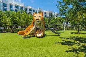 North Miami apartment for rent - A playground with a slide shaped like a lion's head.