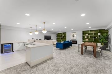 Jersey City apartment for rent - A modern kitchen with a white countertop and a blue sofa.