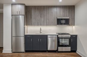 Washington apartment for rent - a kitchen with stainless steel appliances and a refrigerator