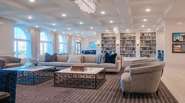 Frederick apartment for rent - a living room with couches and chairs and bookshelves